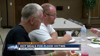 Neighbors serve hot meals to flood victims