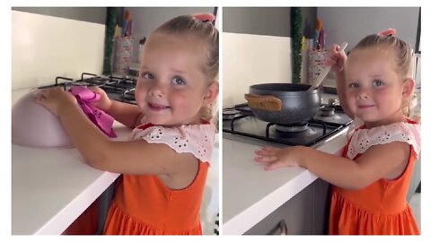 This adorable little girl is cooking