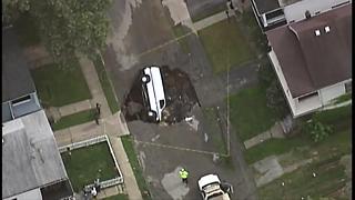 Van swallowed by sinkhole in Cleveland