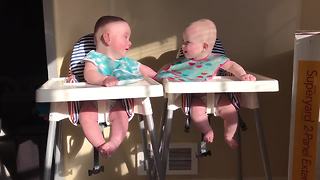 Twins engage in hilarious giggle fit