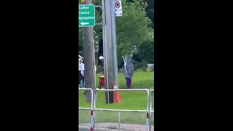 Toronto, Canada: Muslim mothers walk their children through a Jewish neighborhood carrying Swastikas