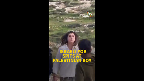ISRAELI YOB SPITS AT PALESTINIAN BOY
