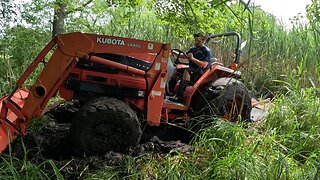 Tractor Stuck in Mud while Bush Hogging