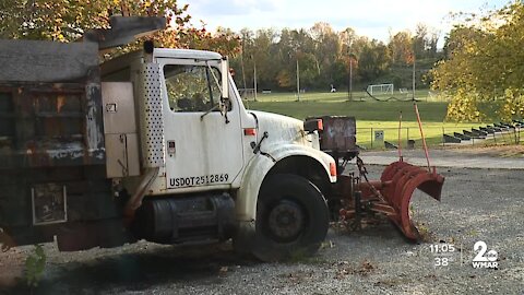 Abandoned dump truck is leaking fuel at Baltimore's Northwest Park