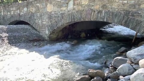 Glacier National Park water rapids under bridge