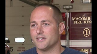 Macomb Township firefighter walking to Grand Rapids