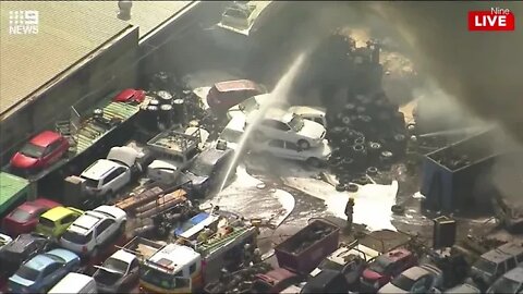 Video: Up to 100 cars alight in huge fire at a wrecking yard