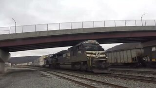 A Coal train gets helpers as an intermodal passes through