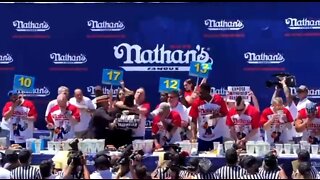 Joey Chestnut Puts Protestor In Head Lock At Hotdog Eating Contest