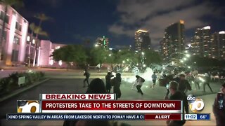 Protesters in downtown San Diego continue to gather into the night