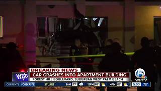 Car crashes into apartment building near Greenacres with family sleeping inside