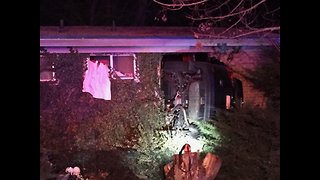 Car Crashes into House