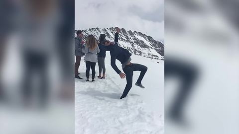 Young Man Does A Back Flip And Falls Face First Into The Snow