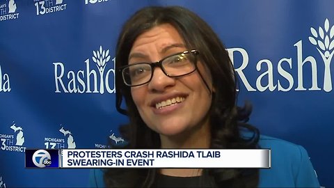 Congresswoman Rashida Tlaib faces protesters at swearing-in event in River Rouge