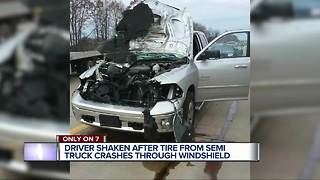 Metro Detroit driver unharmed after semi tire slams into pickup truck on I-75