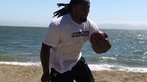 Marshawn Lynch BEASTS Beach Drills While Wearing Boots in the Sand!
