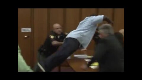 Dad Jumps Over Table To Attack Daughter's Killer in Court