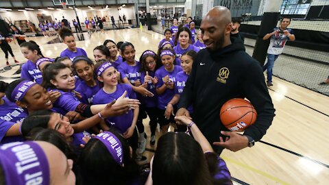 Kobe Bryant talks with girls at the Her Time to Play basketball clinic