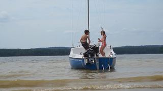 Two Kids Dancing On A Boat