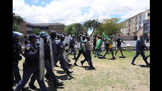 Police escorting the protesters towards the Brackenfell Train station