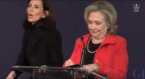 Protester shouts at Hillary Clinton the war criminal