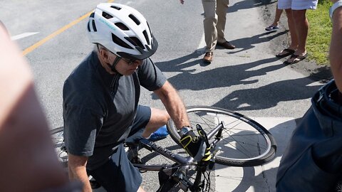 Biden falls while riding his bike