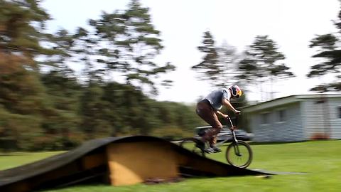 Dude pulls off insane backwards bike flip
