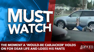 The moment a 'would-be carjacker' holds on for dear life and loses his pants