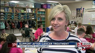 Teacher returns to show of support after absence due to cancer treatment