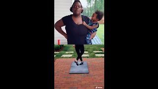 Mom hilariously "dances" while holding her baby