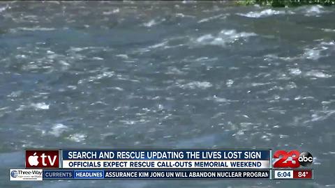 Search and Rescue updating lives lost sign at the mouth of the canyon on Friday