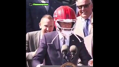 Joe Biden puts on a helmet to protect his brains
