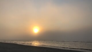 Foggy morning beach walk