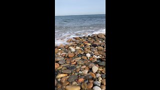 Low tide waves rushing over beach pebbles // Block Island, RI