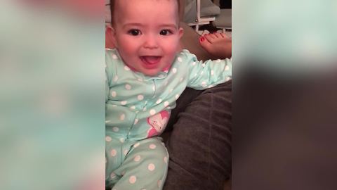 A Cute Baby Girl Says Dada When Her Mom Asks Her To Say Mama