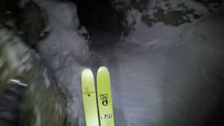 Skier descends mountain at night!
