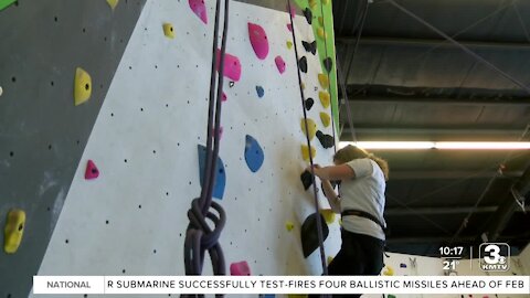 Visually impaired teens learn rock climbing techniques