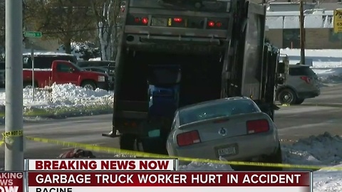 Racine Police investigating collision involving garbage truck and vehicle