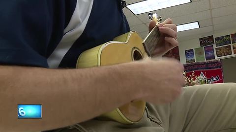 Teacher play Ukulele