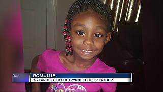 7-year-old killed trying to help father