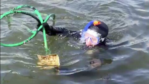 Divers clear Intracoastal Waterway in West Palm Beach of trash