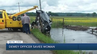 Woman reunites with officer who saved her from rushing water