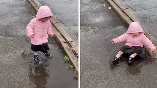 Little Girl Throws Her Entire Body Into Rain Puddle