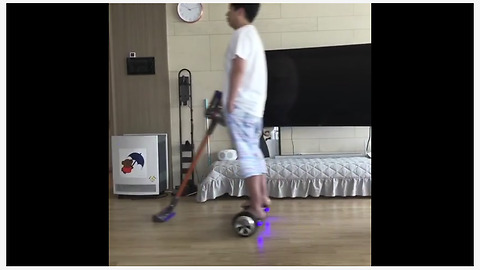 Dad uses hoverboard to clean the floors