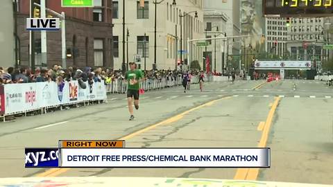 Runners cross the finish line at the Detroit Free Press/Chemical Bank Marathon