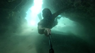 Diver explores breathtaking underwater cave