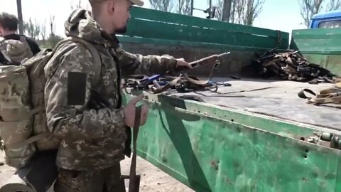 Azov militants handing over weapons to the Russian forces in Mariupol