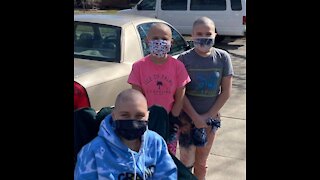 Sisters shave their heads to support brother's girlfriend with cancer