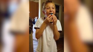 Young Boy Eats A Whole Cupcake In One Bite