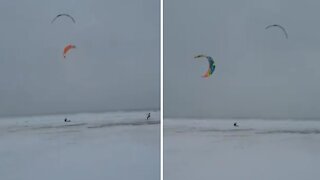Kite surfing on frozen Lake Michigan during Chicago winter storm